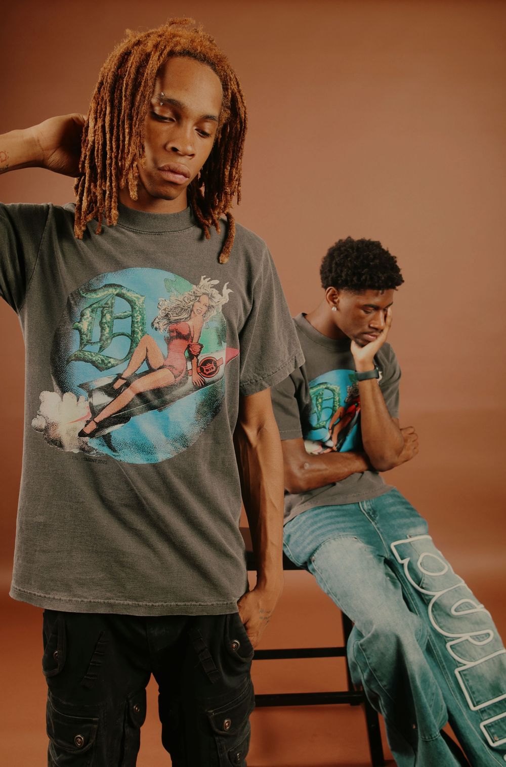 A series of fashion photos showing someone modeling a graphic t-shirt design with cargo pants against a brown backdrop.