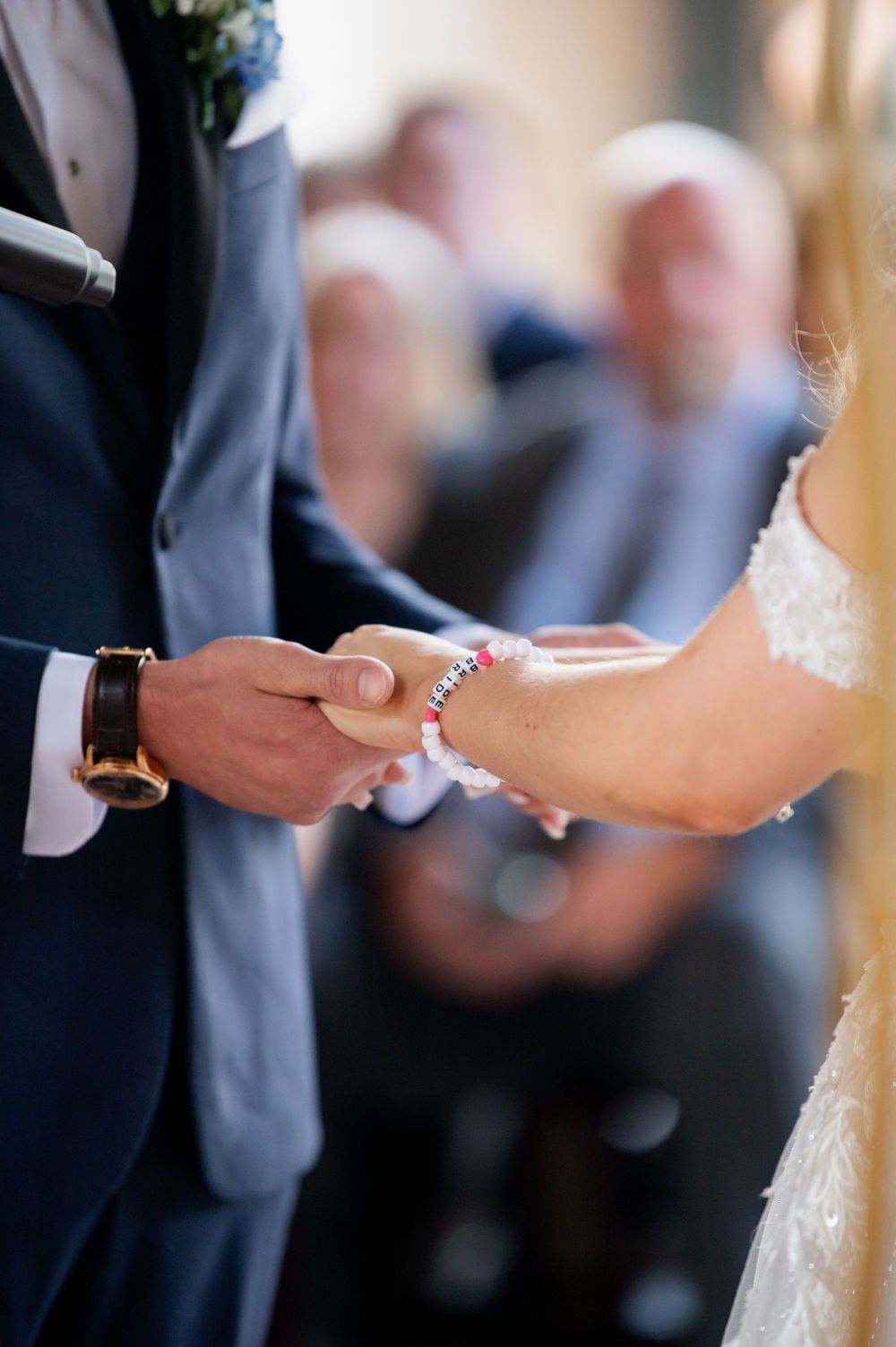 Exchange of rings during traditional wedding ceremony.
