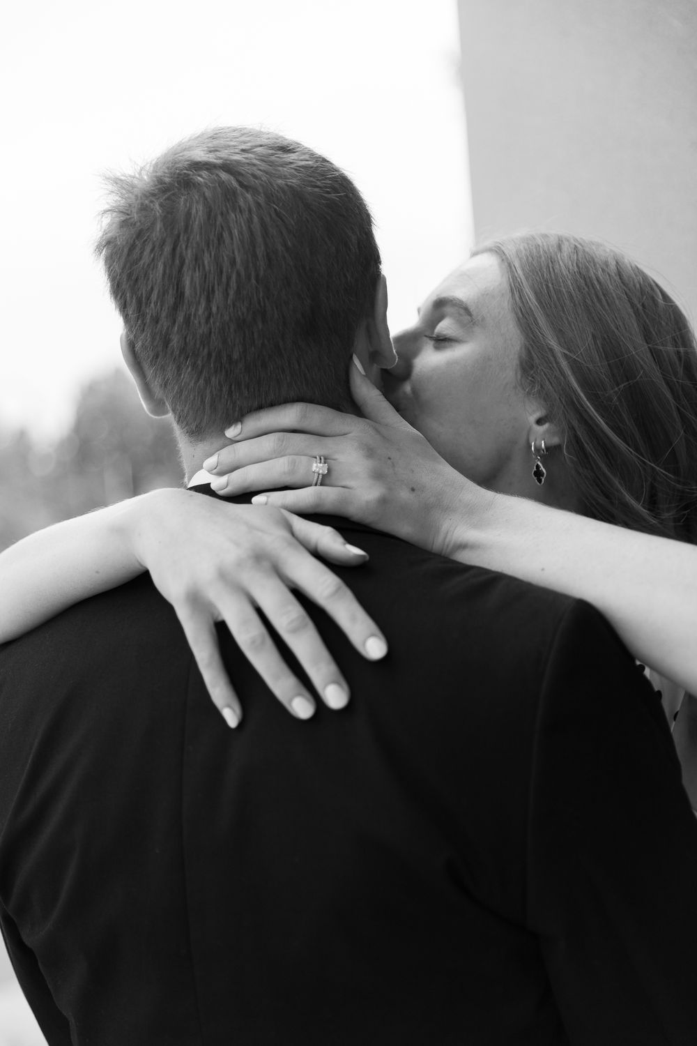Close-up sequence showing hands and shoulders of two people in an intimate embrace.