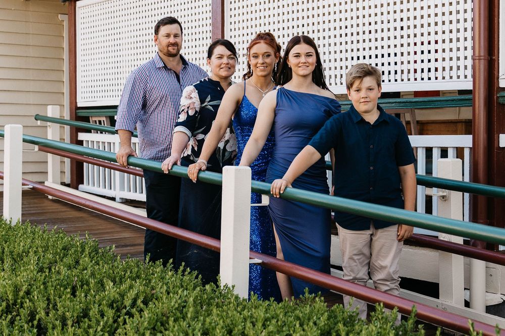 Family standing on a ramp at formal photo shoot