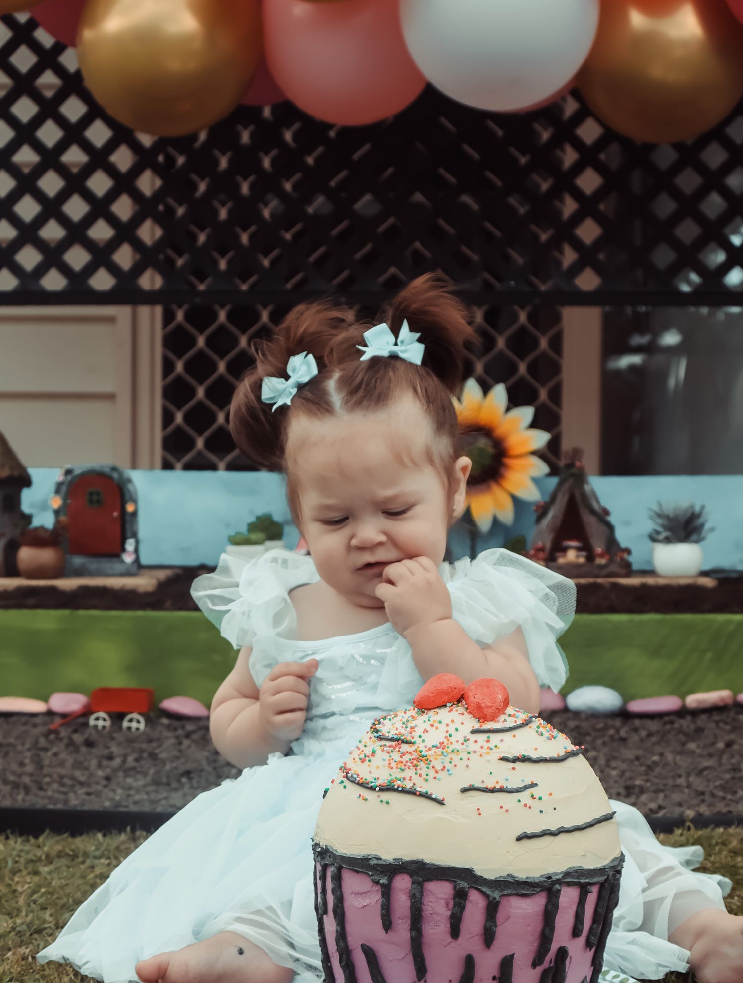 Cake smash photography documenting a first birthday filled with mess, laughter, and fun