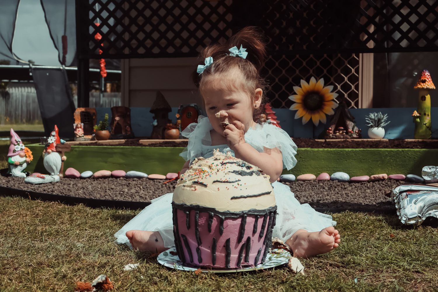 Cake smash photography documenting a first birthday filled with mess, laughter, and fun