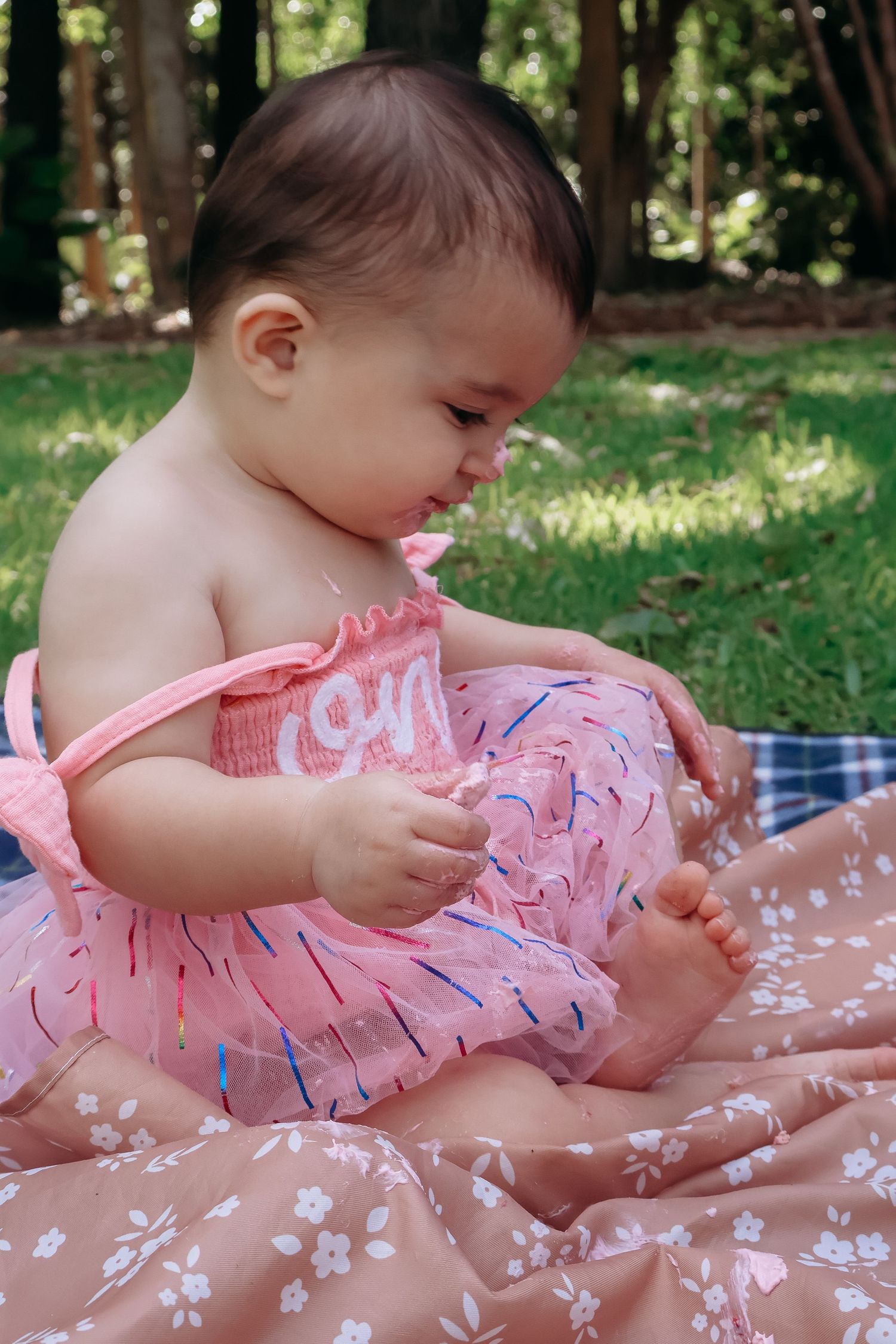 Cake smash photography documenting a first birthday filled with mess, laughter, and fun
