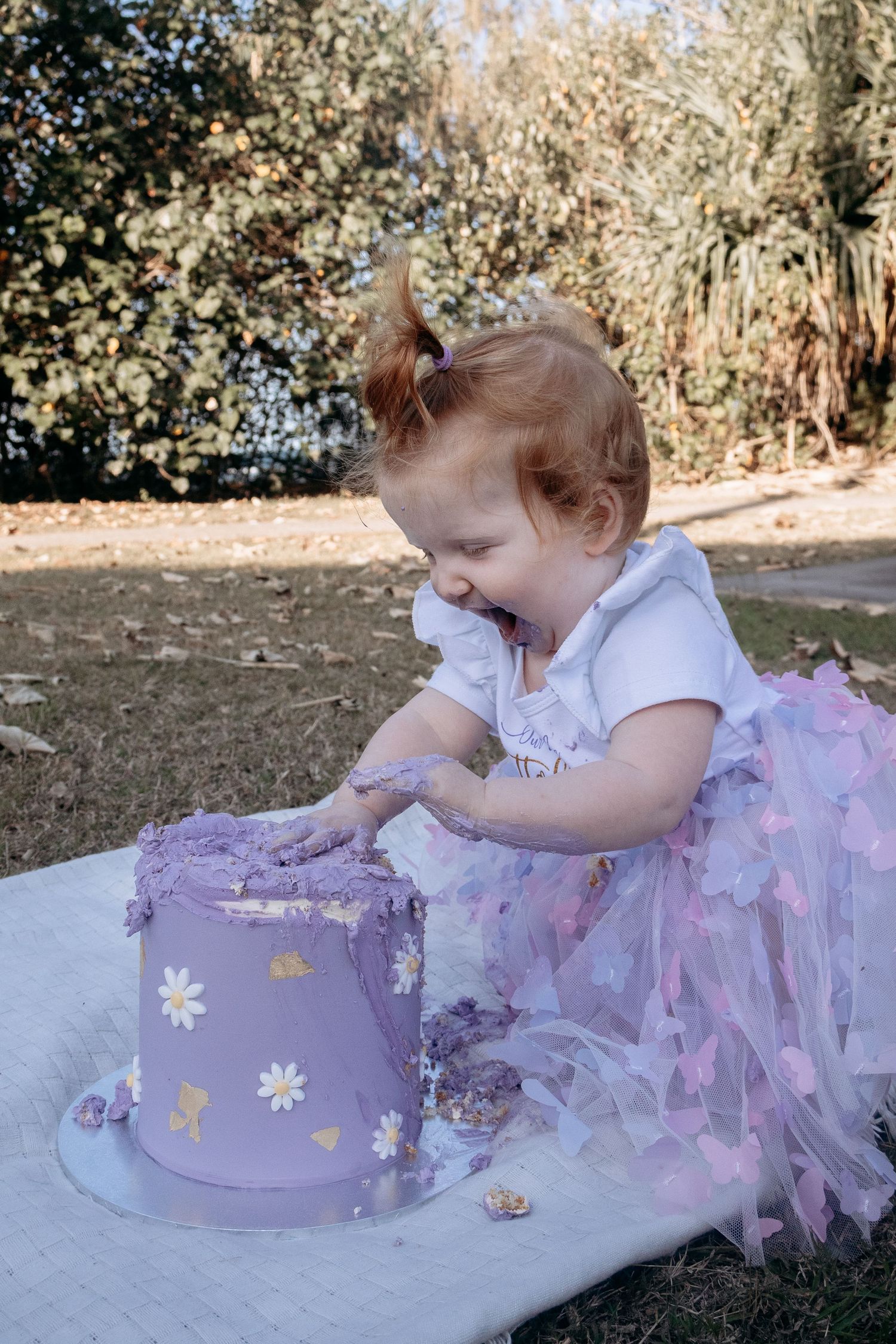 Cake smash photography documenting a first birthday filled with mess, laughter, and fun