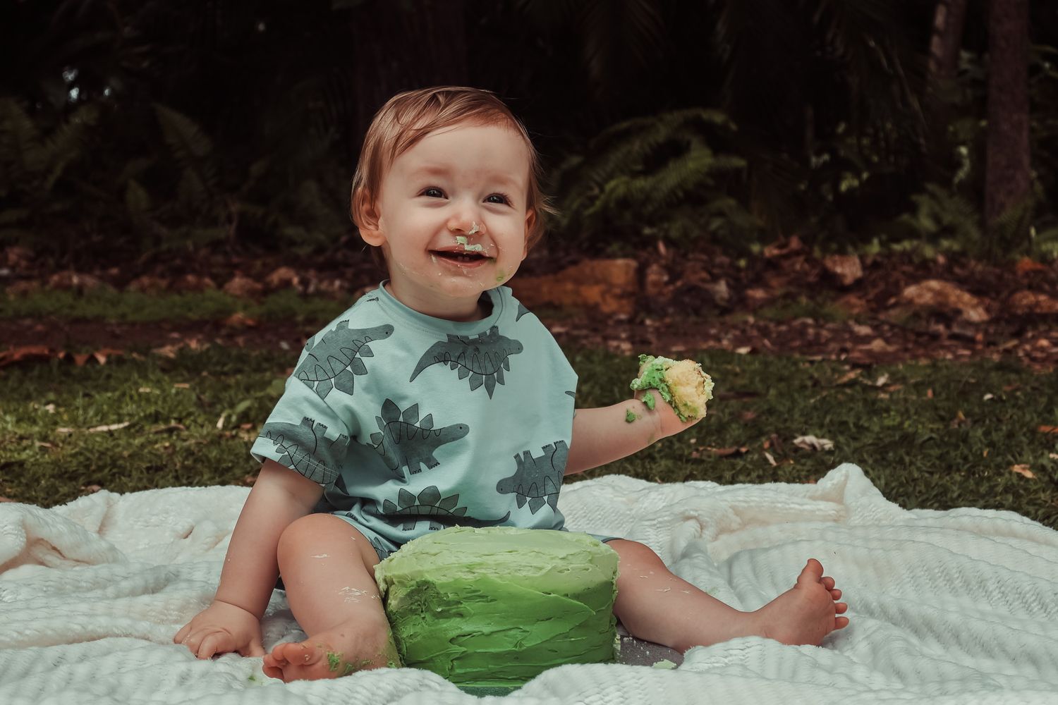 Cake smash photography documenting a first birthday filled with mess, laughter, and fun