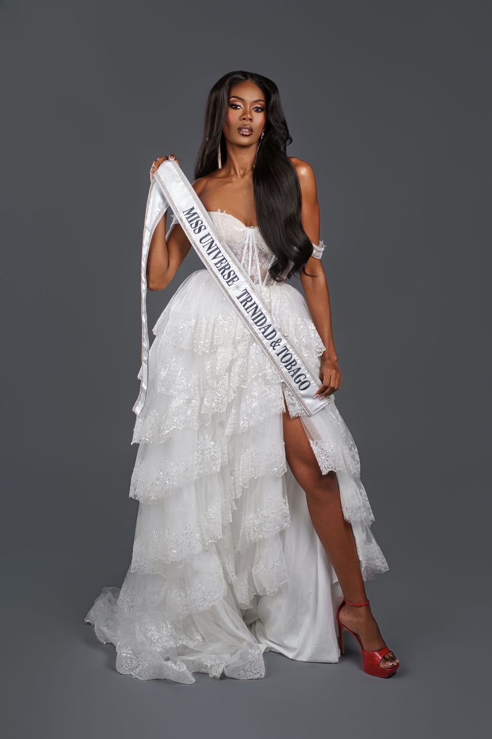 Model wearing white pageant sash and ruffled gown strikes dynamic poses in professional studio portraits.