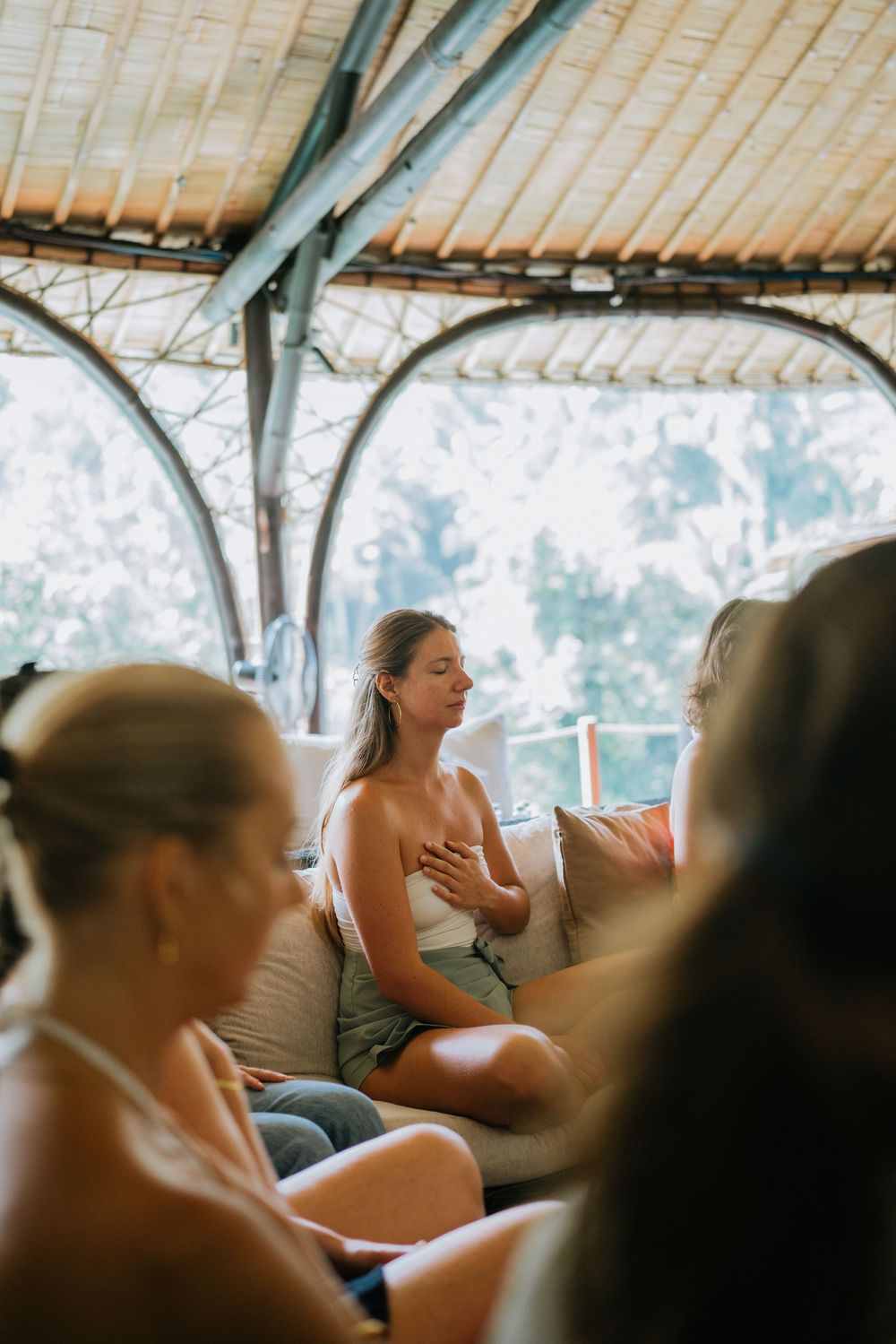 Group retreat photography session at K-Club Ubud’s luxury villa setting.