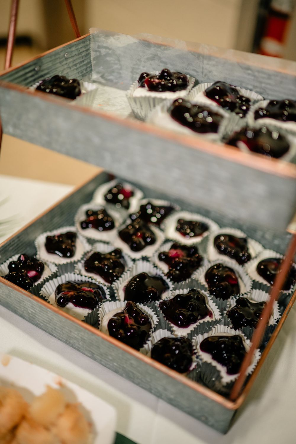 Artfully arranged dark chocolate truffles in decorative paper cups.