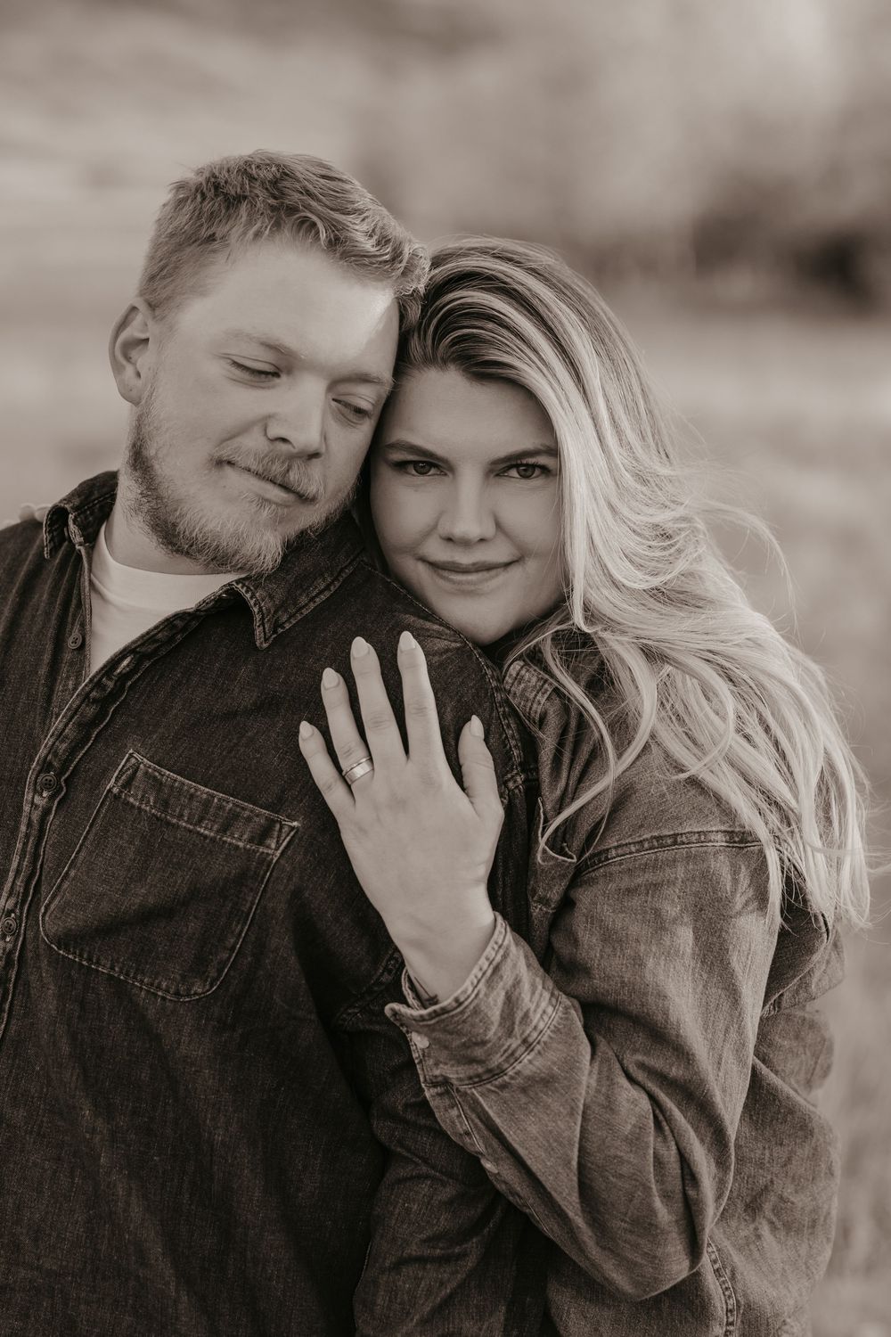 Montana Wedding Photographer captured western couple leaning up against the fence under the Paradise valley Mountains in Pray, Montana