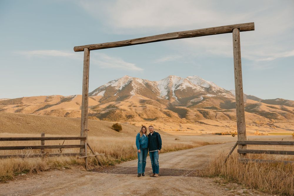 Pray Montana engagement photos standing under a western Montana mountain along a dirt road. Pray, Montana Engagement Photographer