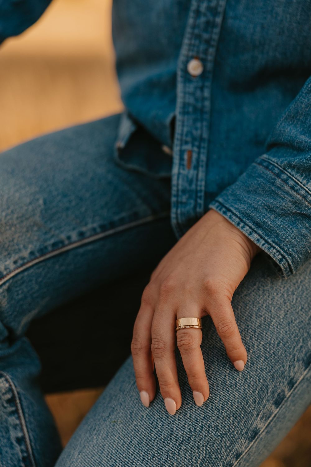 Livingston, Montana Photographer captures cigar band ring on western women in her denim jeans, in Paradise Valley Montana.