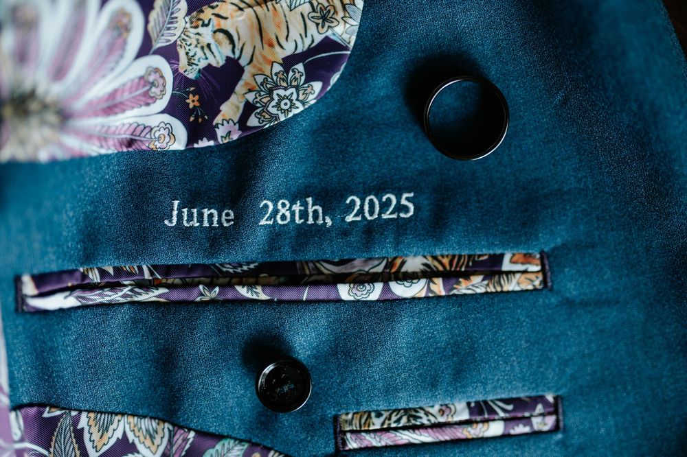 Wedding date June 28th 2025 displayed on dark blue textured background.
