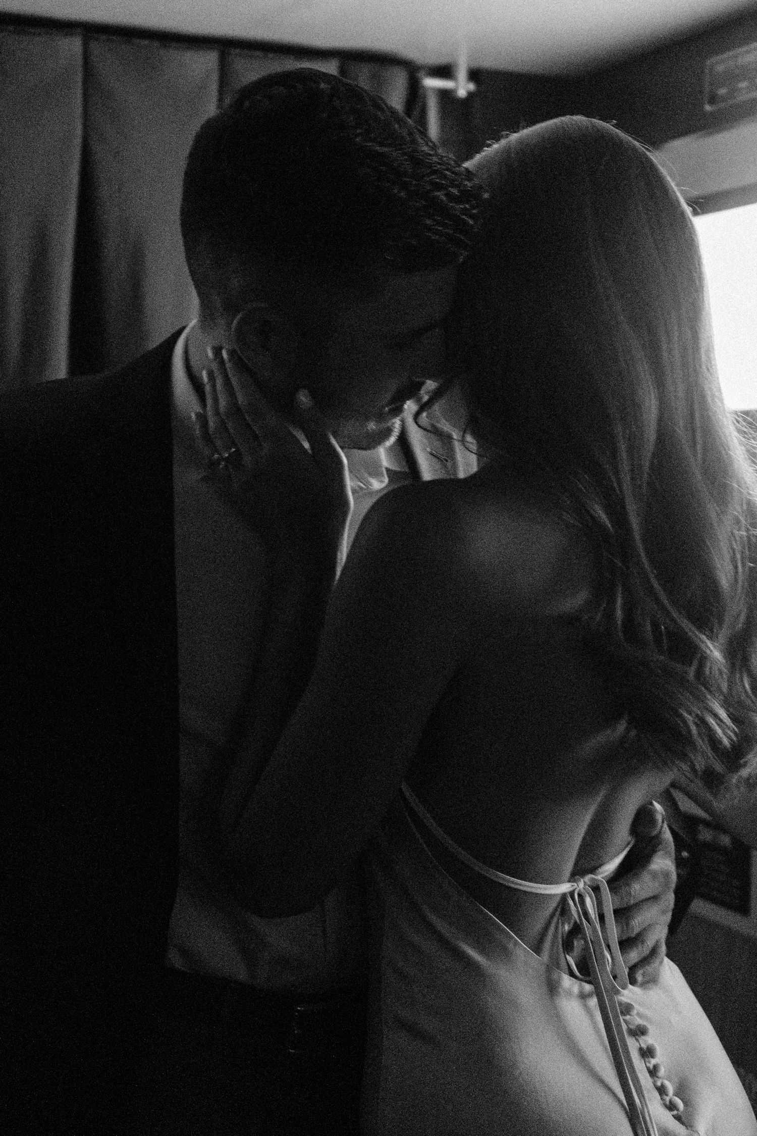 Intimate black and white photo of couple embracing during a Denver engagement session