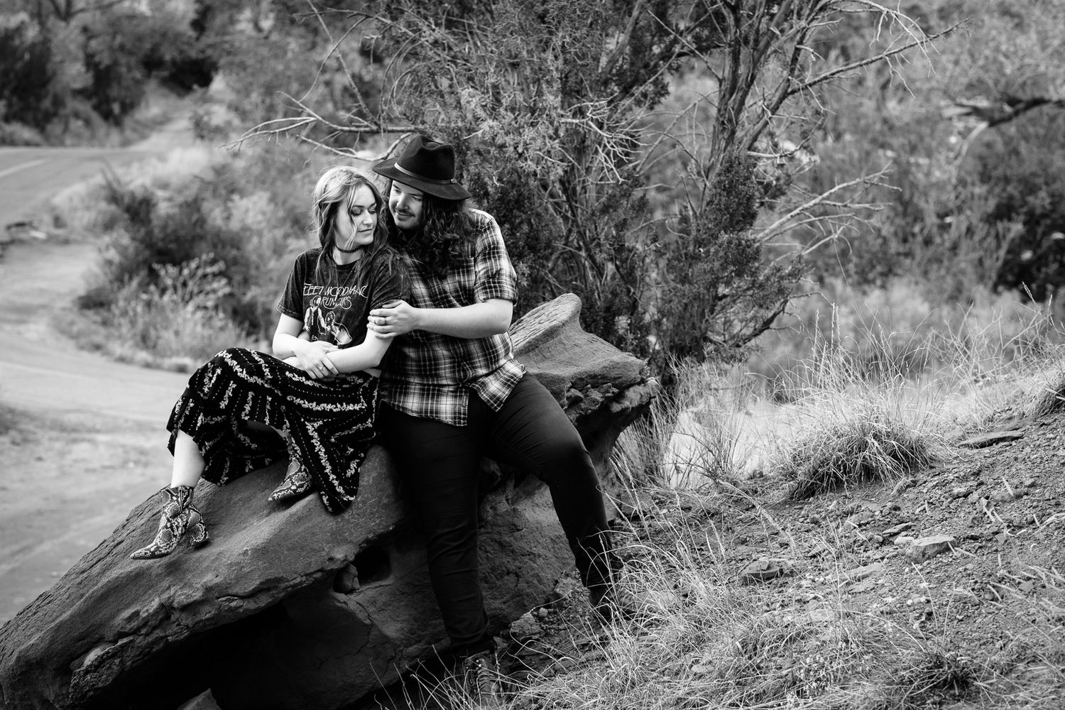 Beautiful outdoor engagement photography; couple on rock; black and white; Clarissa Anello