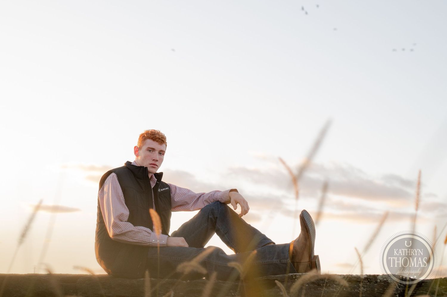 A casual sunset photoshoot with soft lighting and rural backdrop.