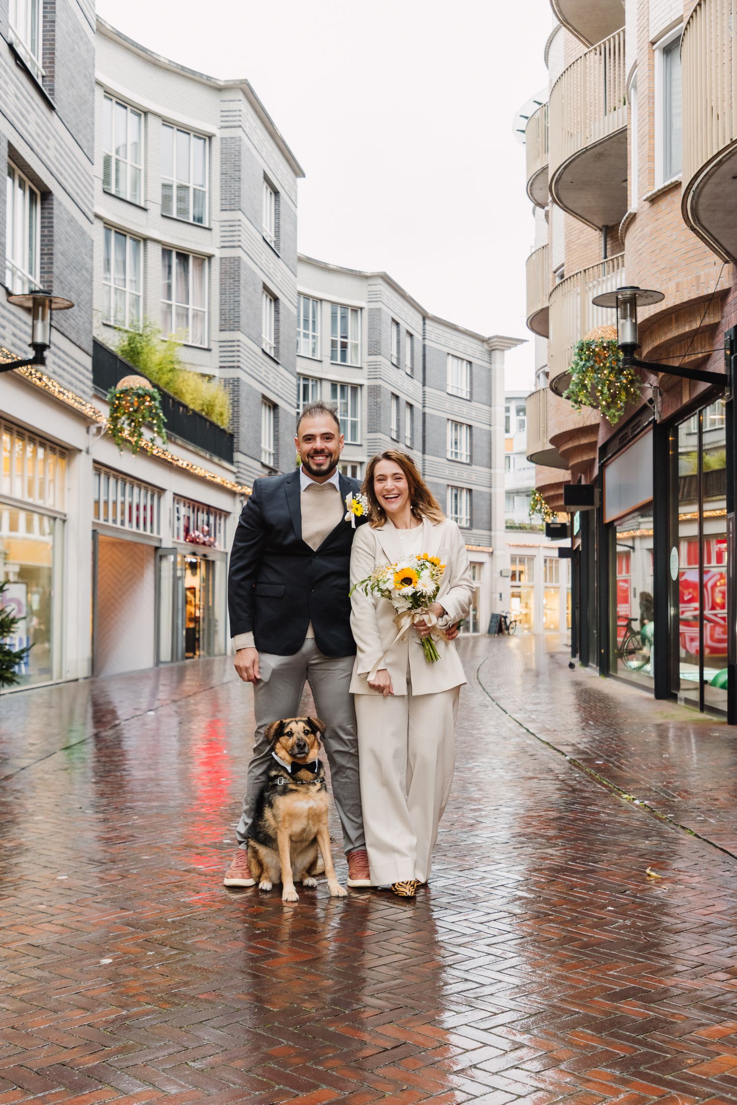 Urban bridal couple portrait with dog on their wedding day in Amsterdam