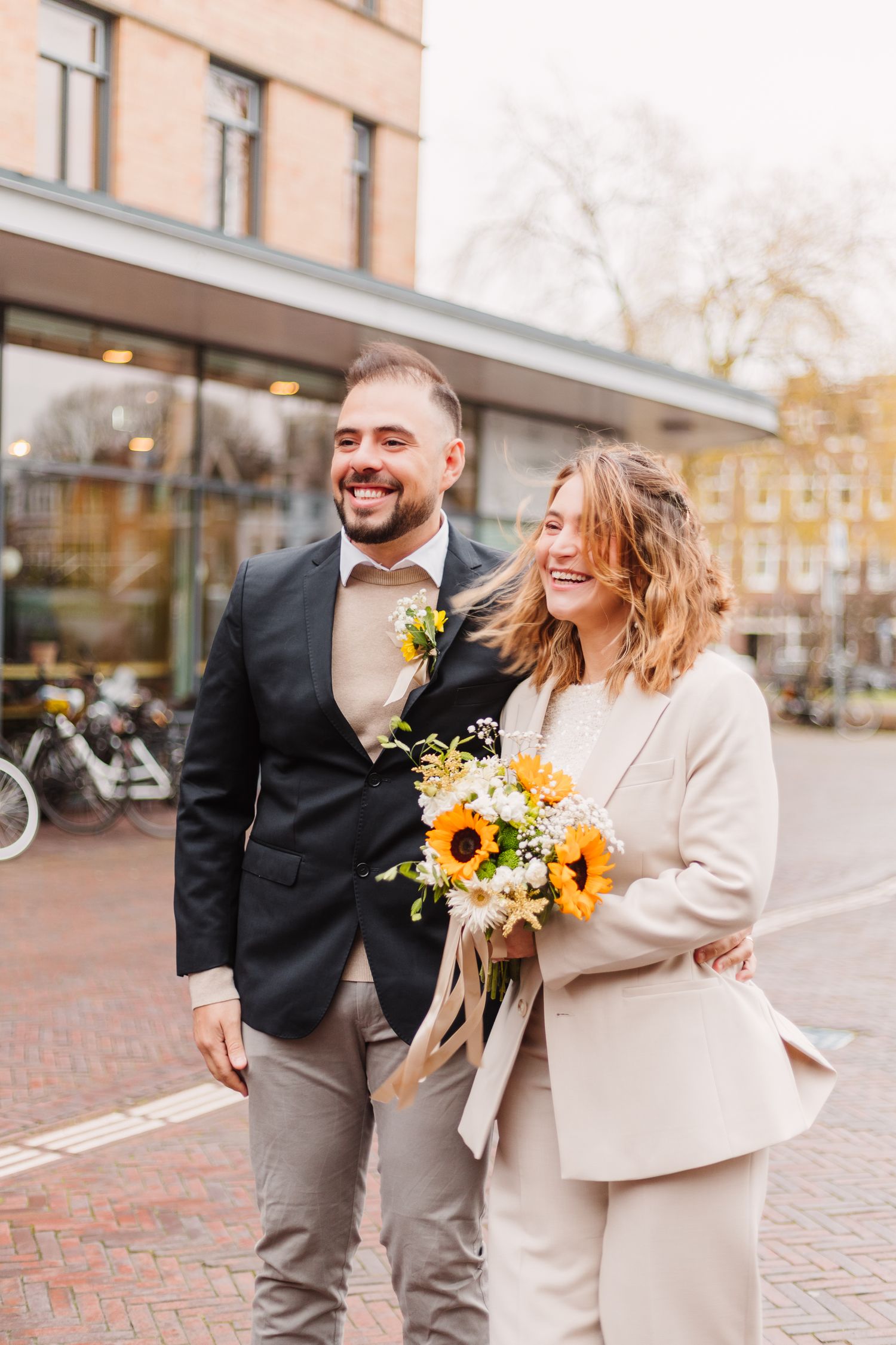 Bridal couple spontaneous portrait after city hall gemeente wedding in Amsterdam Oost