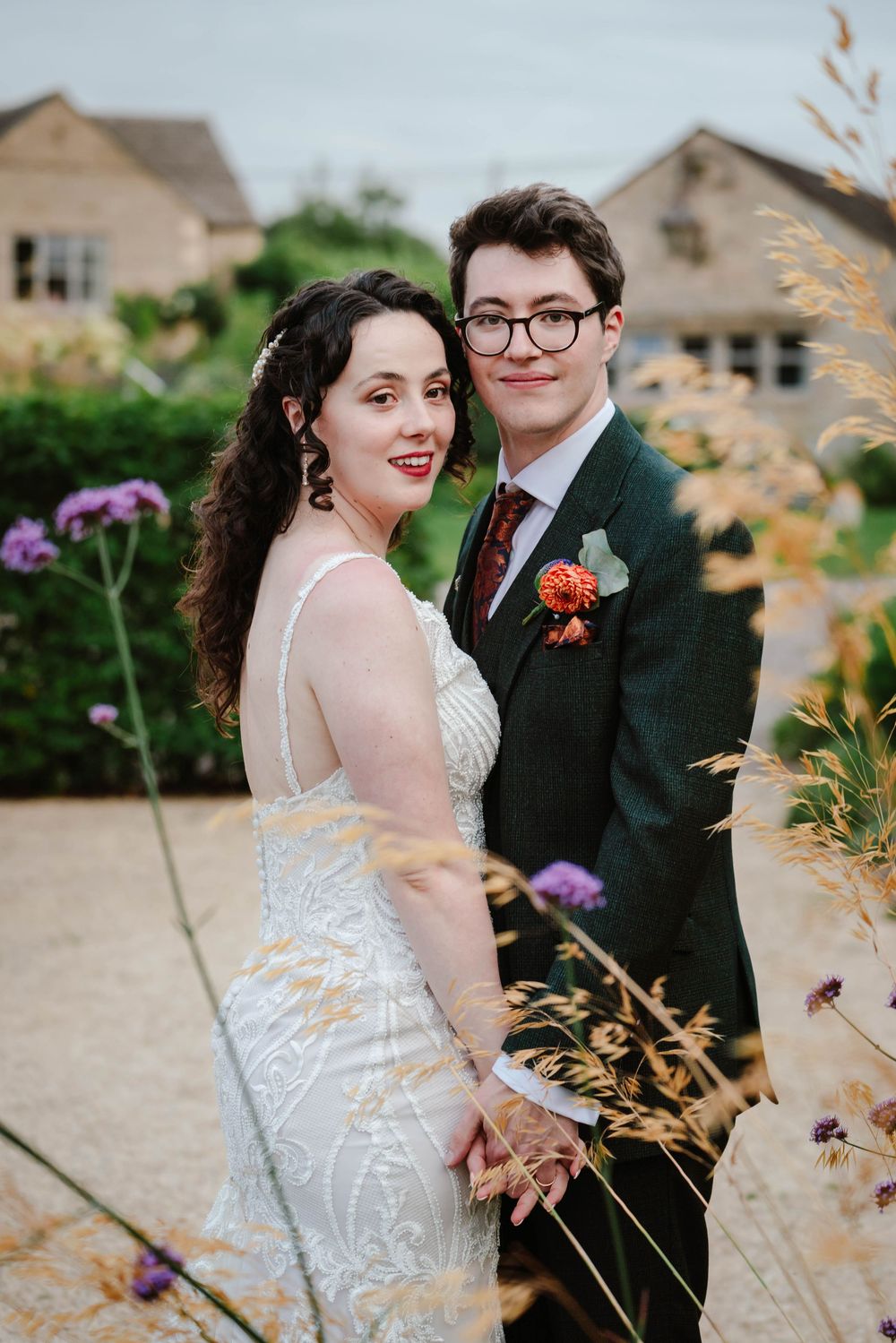 The Frogmill wedding venue Cheltenham Cotswolds Gloucestershire couple in front of august flowers