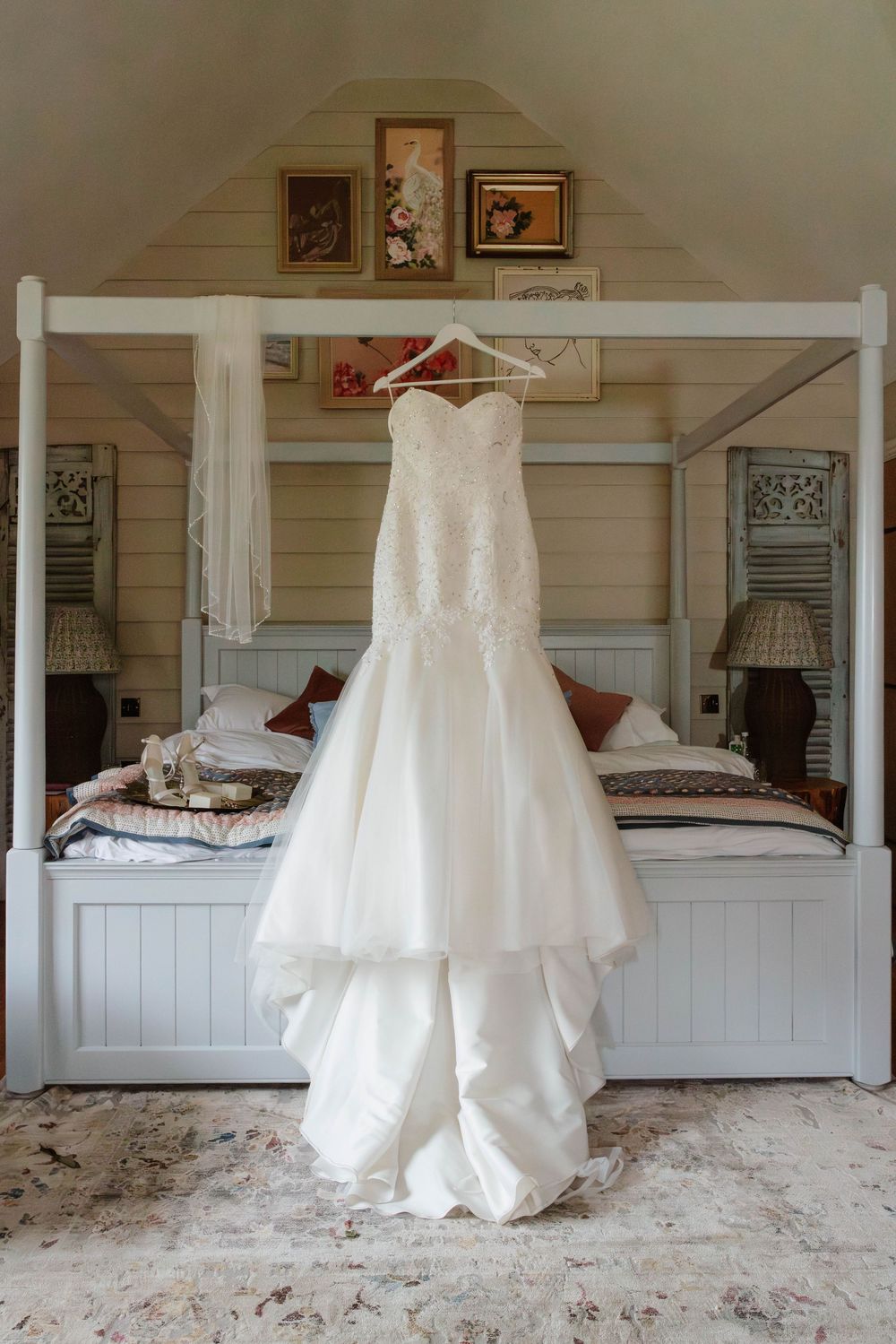 The Frogmill wedding venue Cheltenham Cotswolds dress hanging on bed