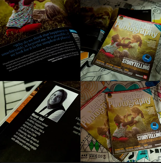 Photography magazines and books scattered on a dark surface.