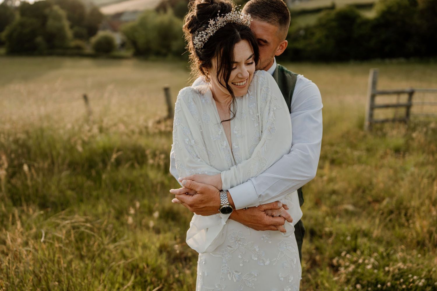 Golden hour portrait in a serene meadow with soft, romantic lighting.
