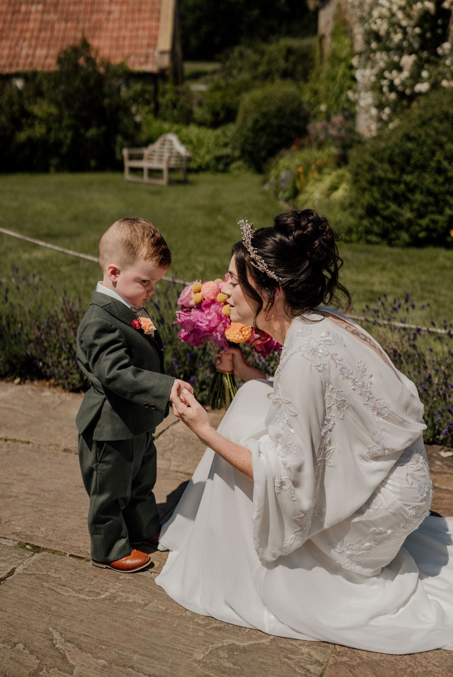 A heartwarming moment shared during an outdoor wedding photoshoot on stone steps.