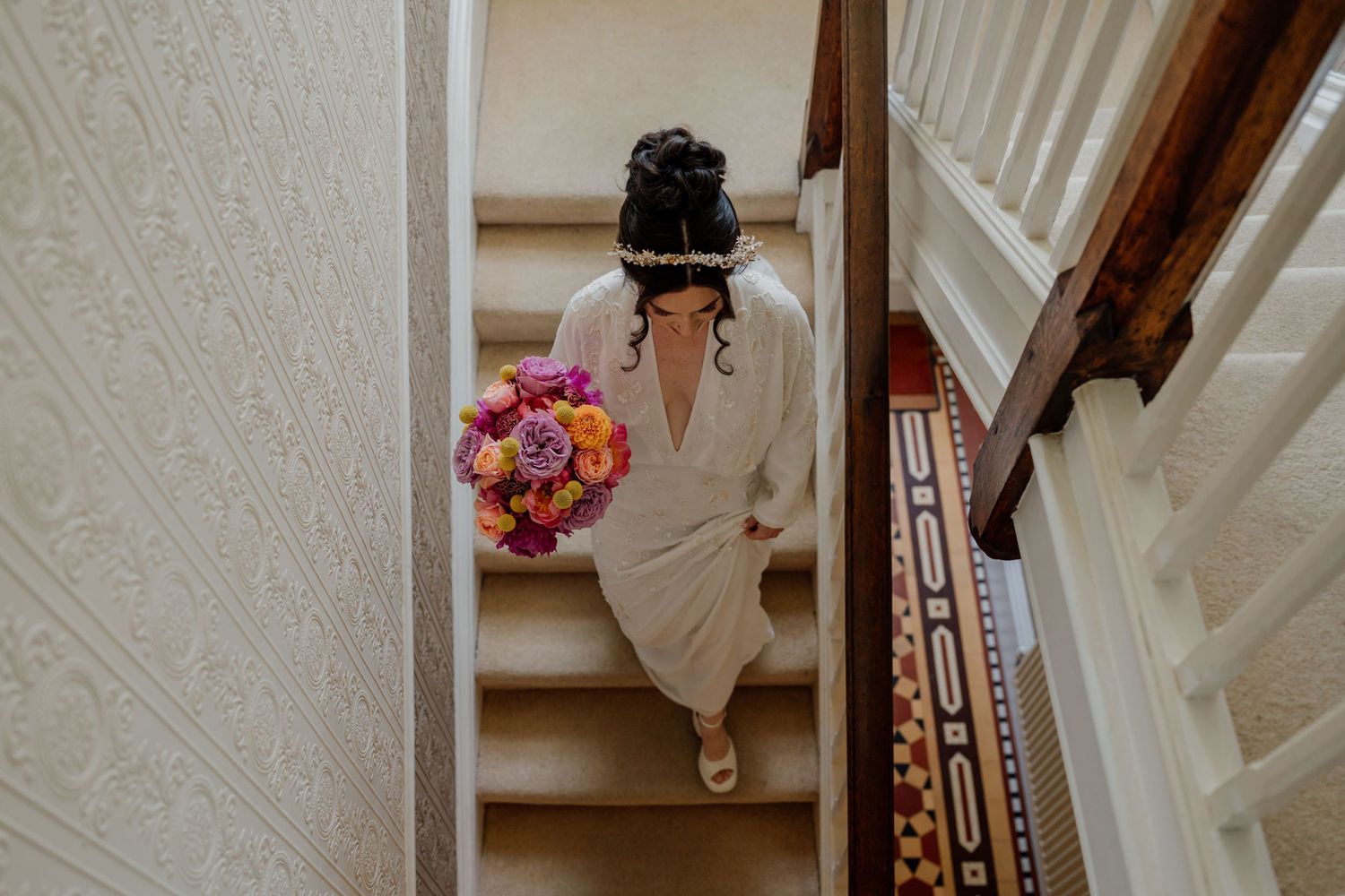 White wooden staircase with rustic details in a wedding venue.