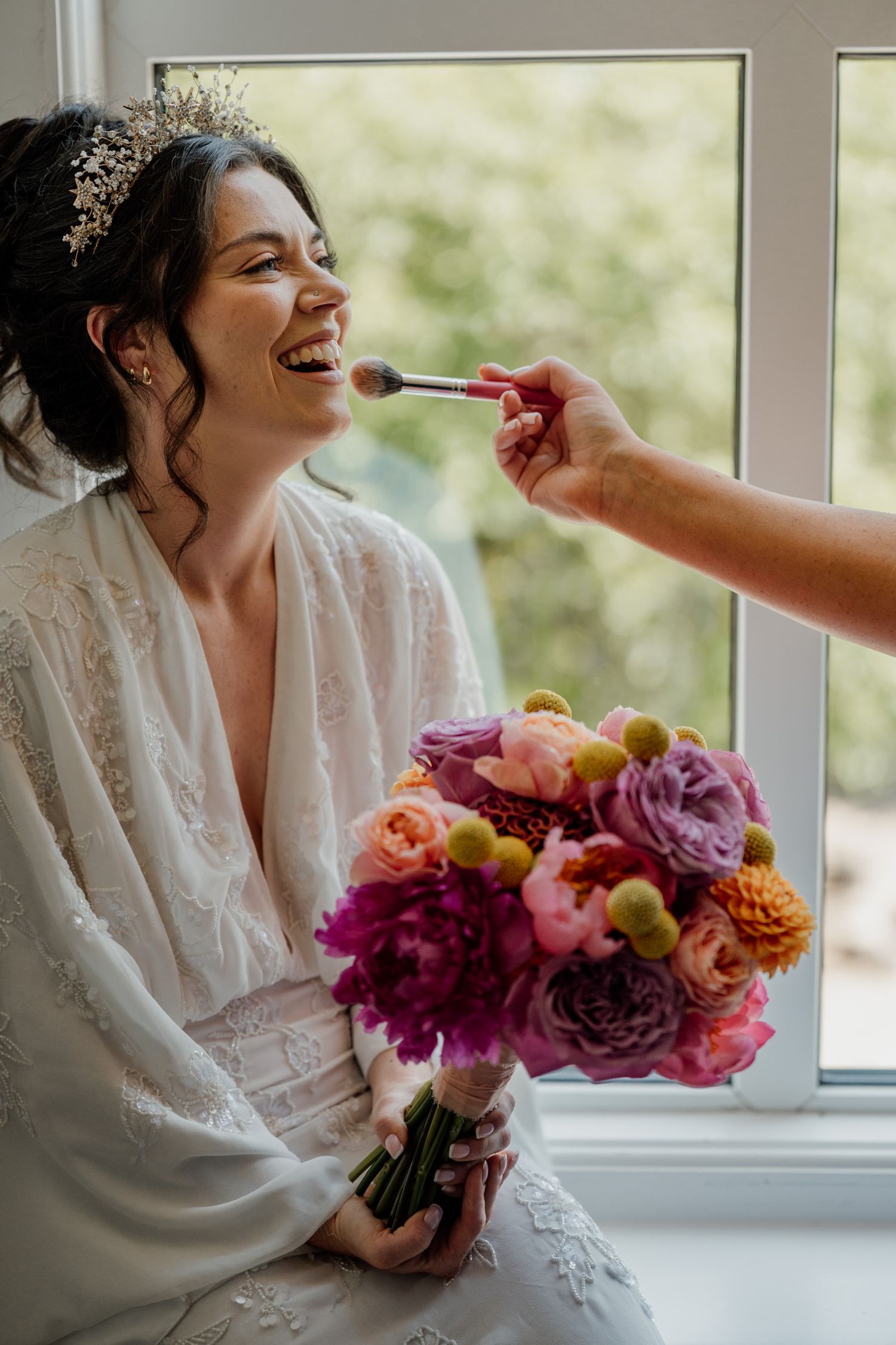 Sequential images of someone in white lace robe holding colorful bouquet by window during wedding preparations.