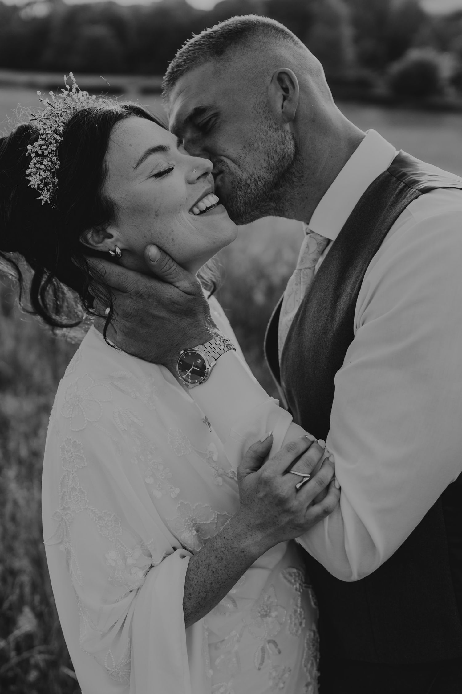 Black and white romantic wedding portraits showing intimate moments between newlyweds outdoors.