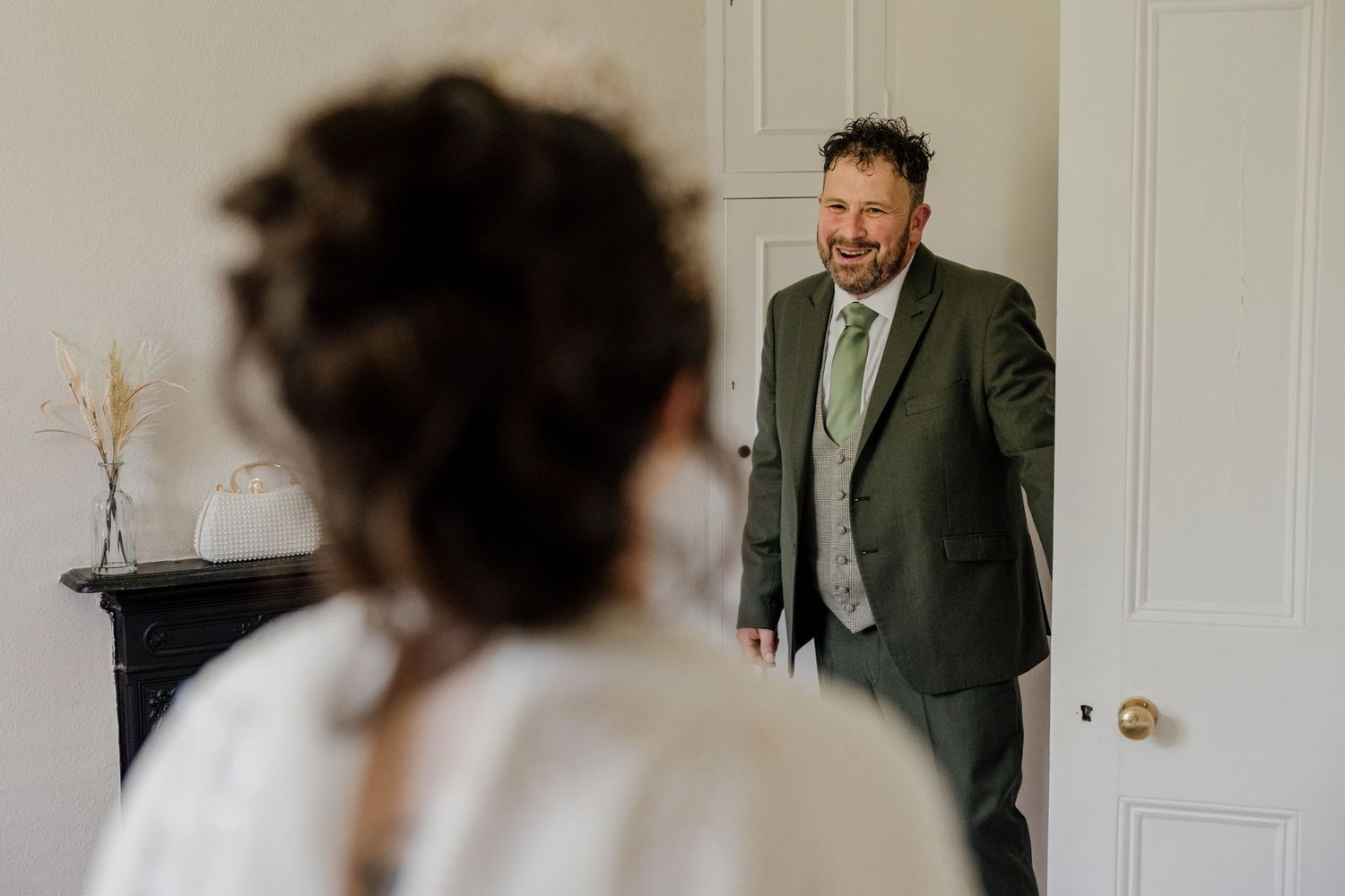 Series of candid getting-ready moments captured in a bright white room with wooden floors.