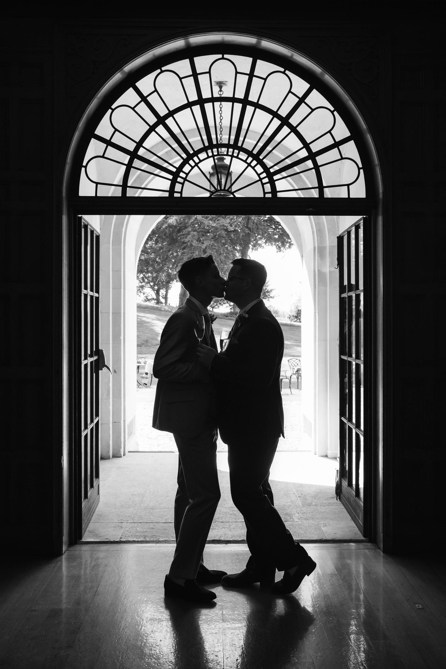 Coombe Lodge Wedding Photographer Zara Davis Photography two groom silhouette kissing LGBTQIA+ black and white romantic