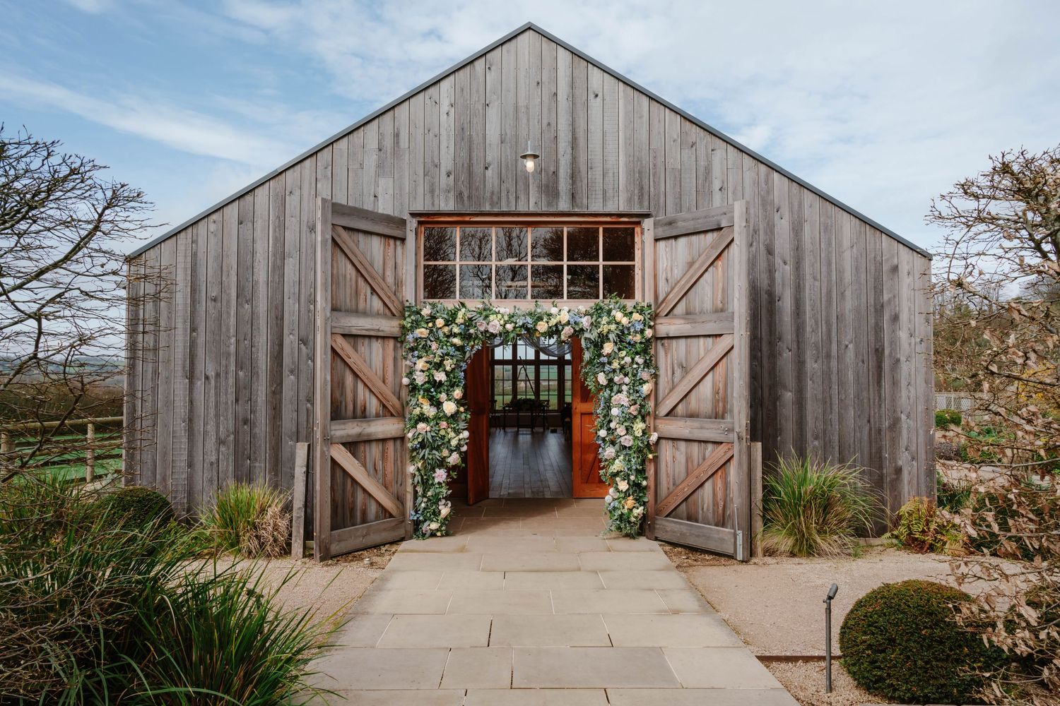 Hyde House Wedding Photographer Cotswolds Zara Davis Photography Gloucestershire Cheltenham entrance of barn ceremony space