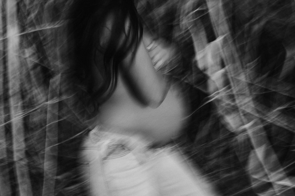Abstract black and white portrait series with textured overlays.
