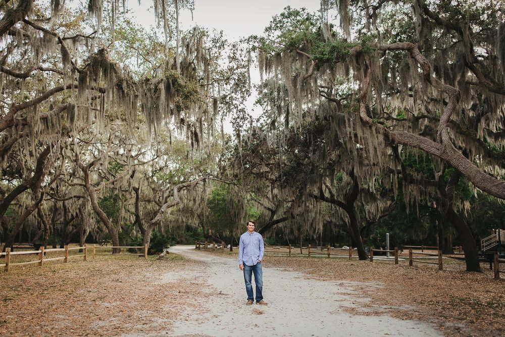 Spanish moss draping from oak trees creates a romantic atmosphere in this Southern garden pathway.