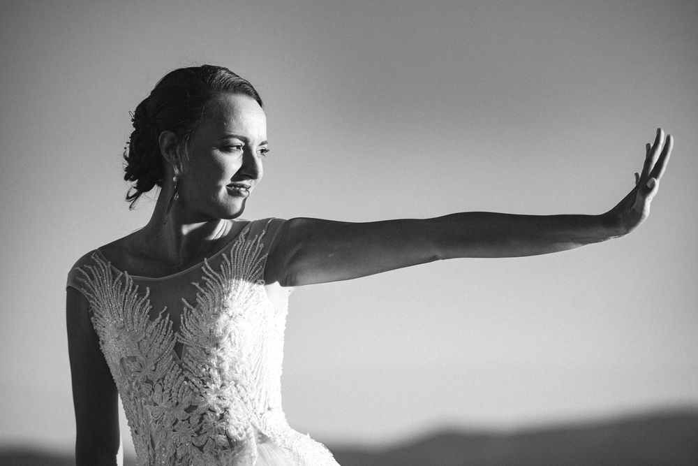 Artistic black and white portraits of a bride in a lace wedding dress.