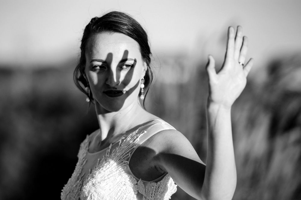 Dramatic black and white photos showing graceful bridal poses.
