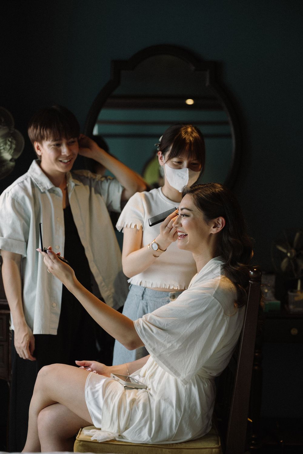 A sequence of candid moments showing a couple playfully feeding each other dessert in white attire.