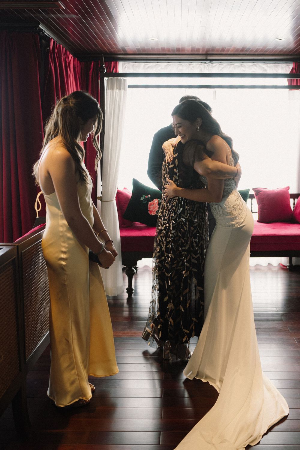 A series of touching wedding moments between two people dancing in a sunlit room with a window.