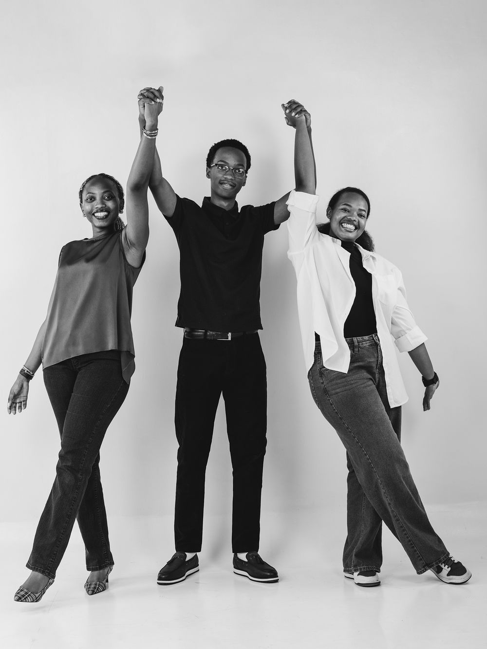Series of expressive black and white photos showing dancing and movement poses against white background.