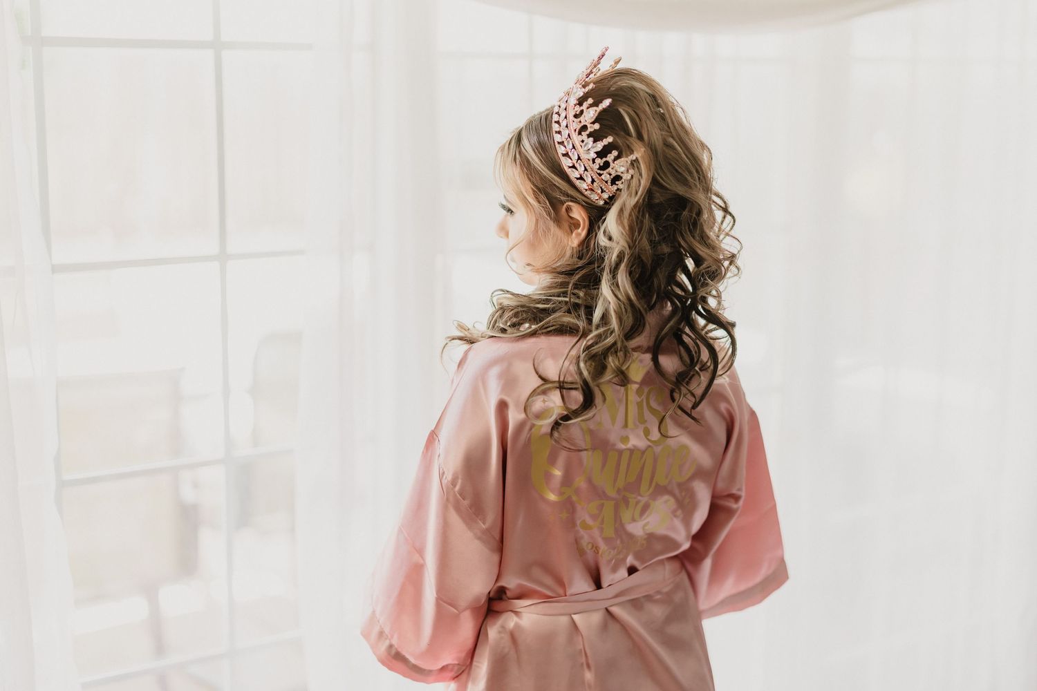 Light and airy indoor photoshoot setup with blush pink tones and soft natural lighting.