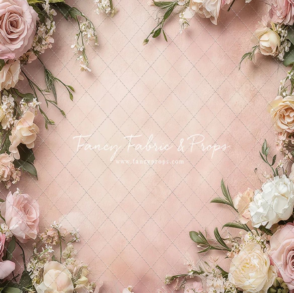 Romantic floral background with delicate pink roses and white flowers arranged on soft blush pink backdrop.