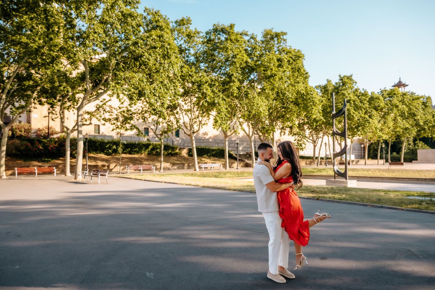 Magical honeymoon moment captured with love and golden sunlight.