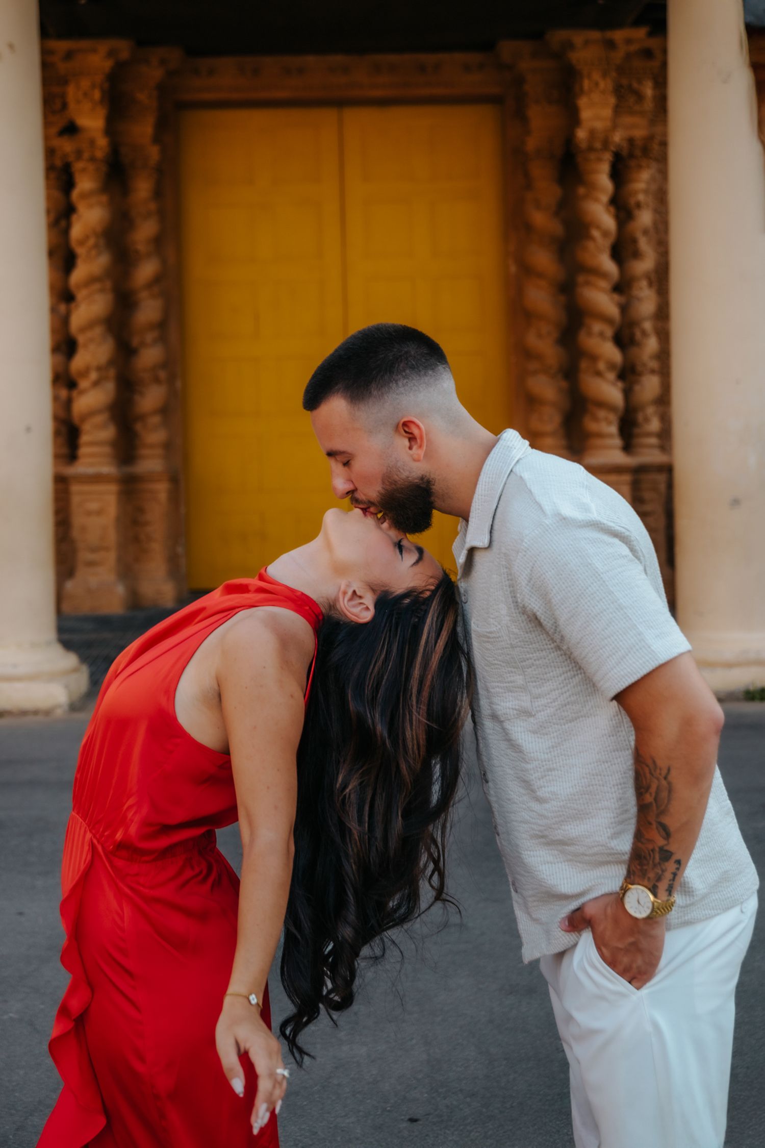 Playful candid moments of the couple walking through Montjuïc.