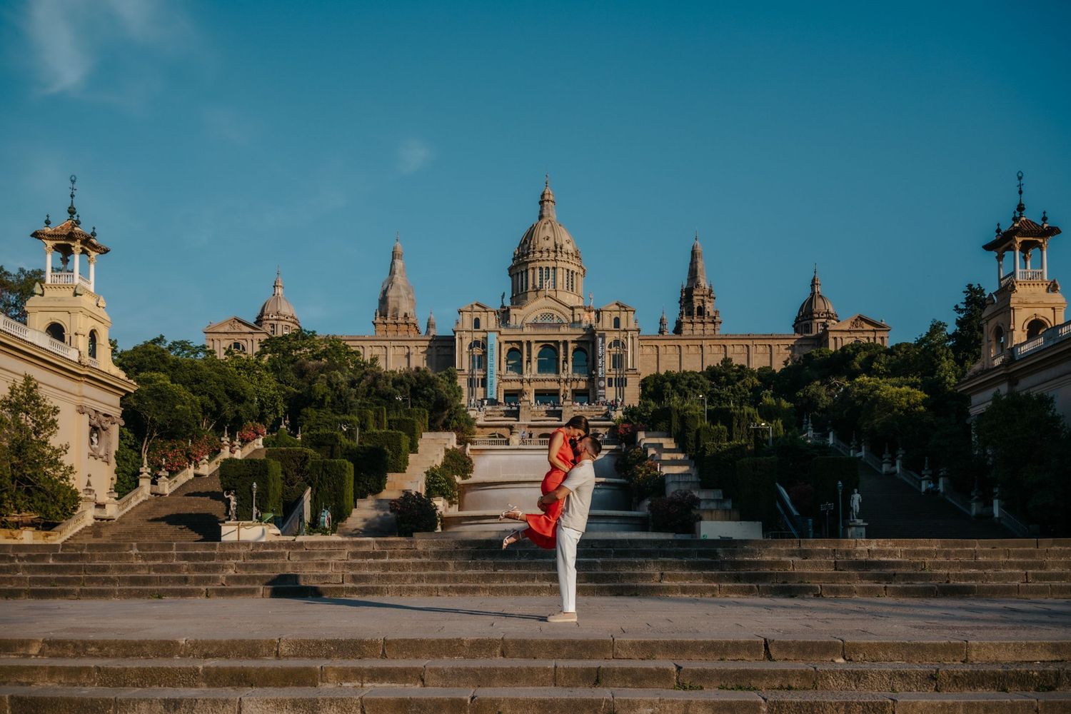 Romantic close-up of Ajla & Hako with Barcelona views behind them.