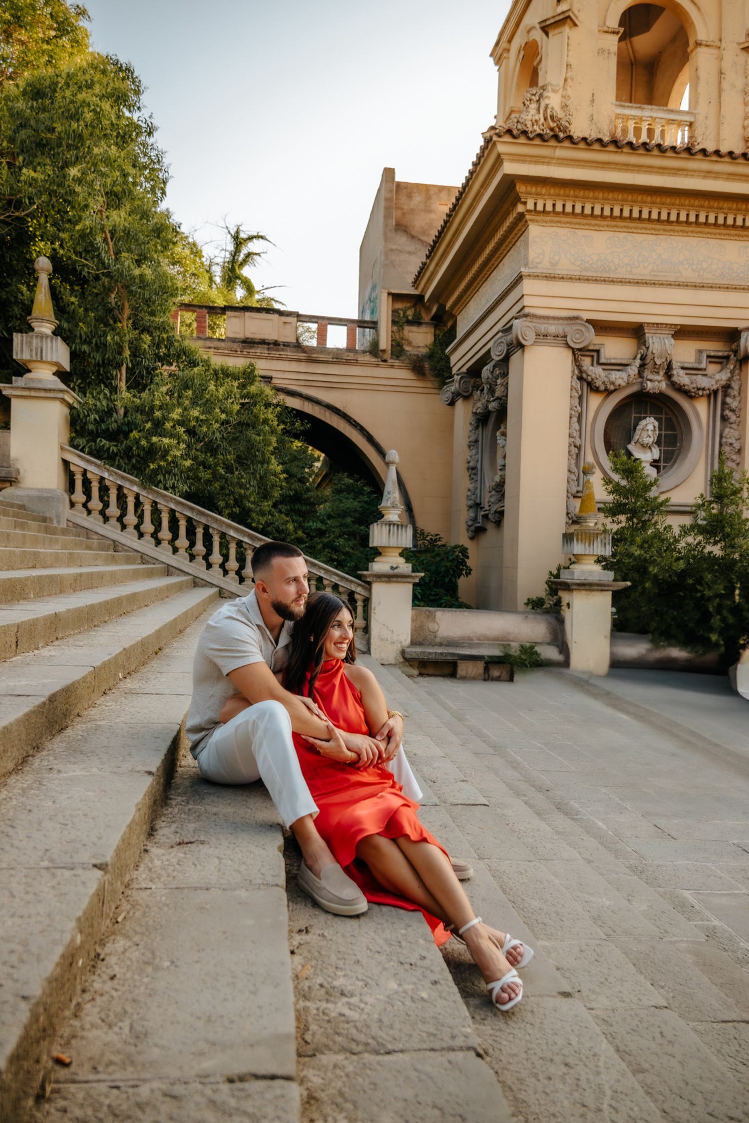 Couple enjoying a quiet moment sitting together on park steps.