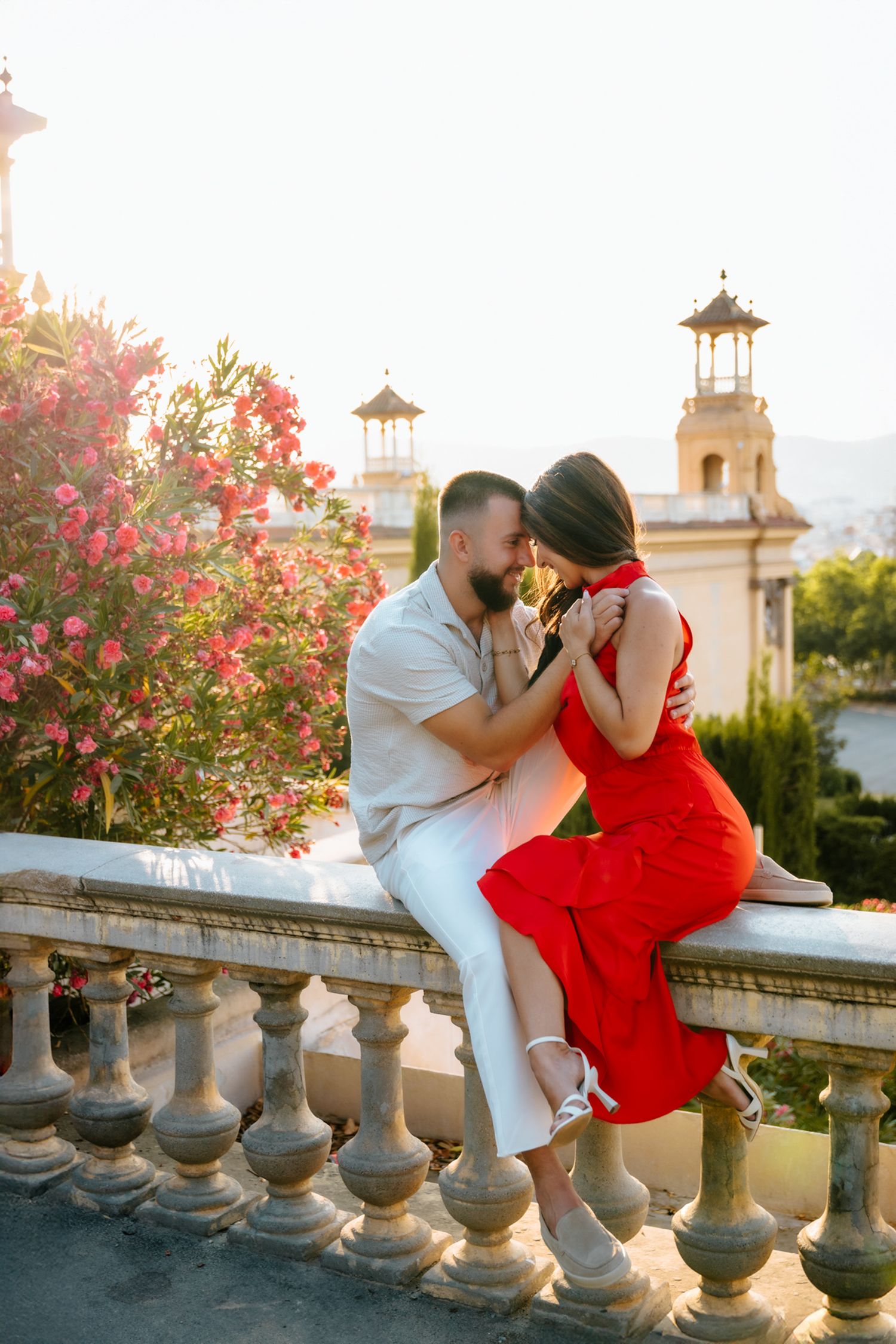Ajla glowing as Hako hugs her tenderly during their photoshoot.