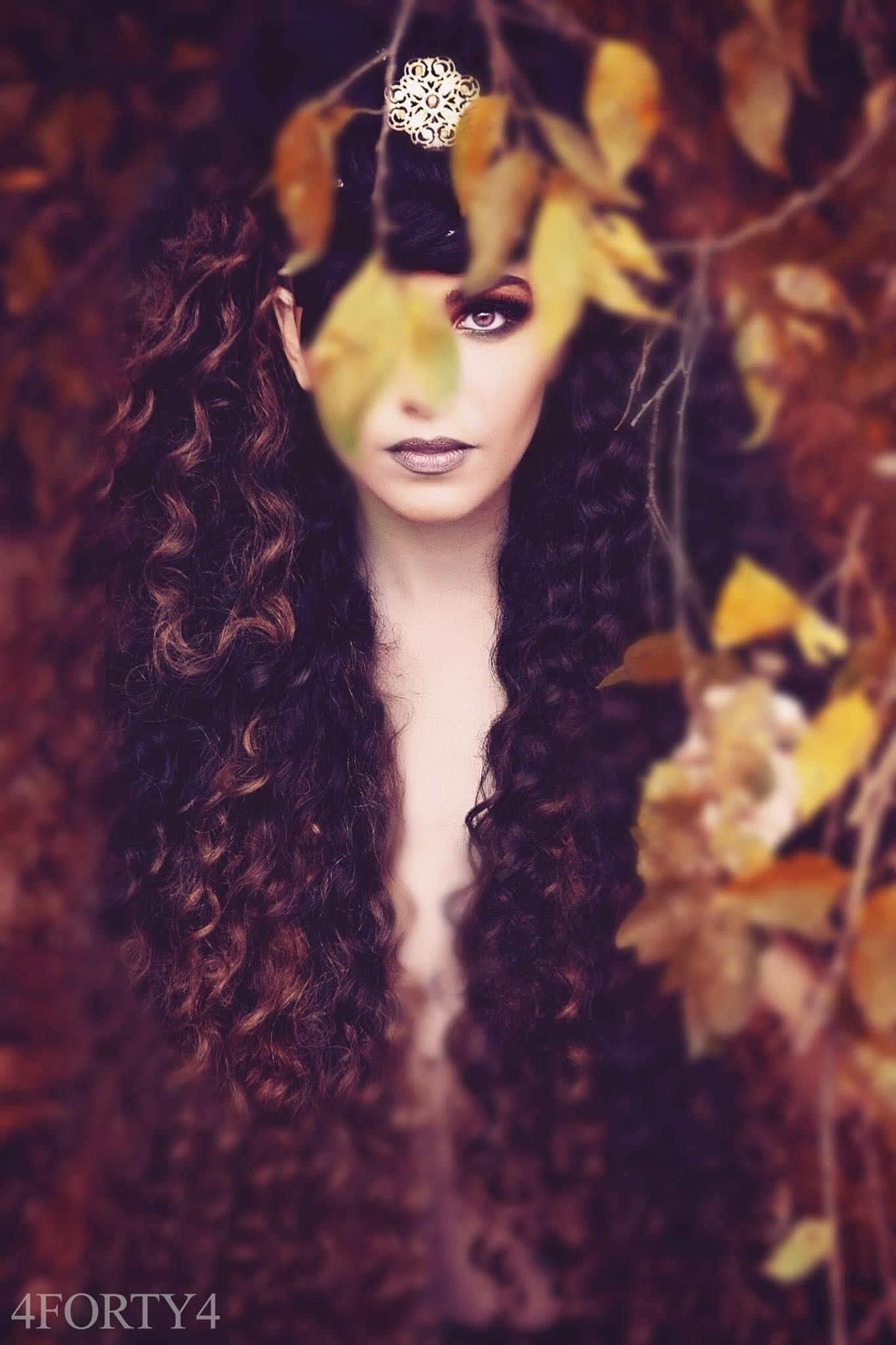 Autumn-themed fine art portrait with golden leaves and a delicate crown detail.
