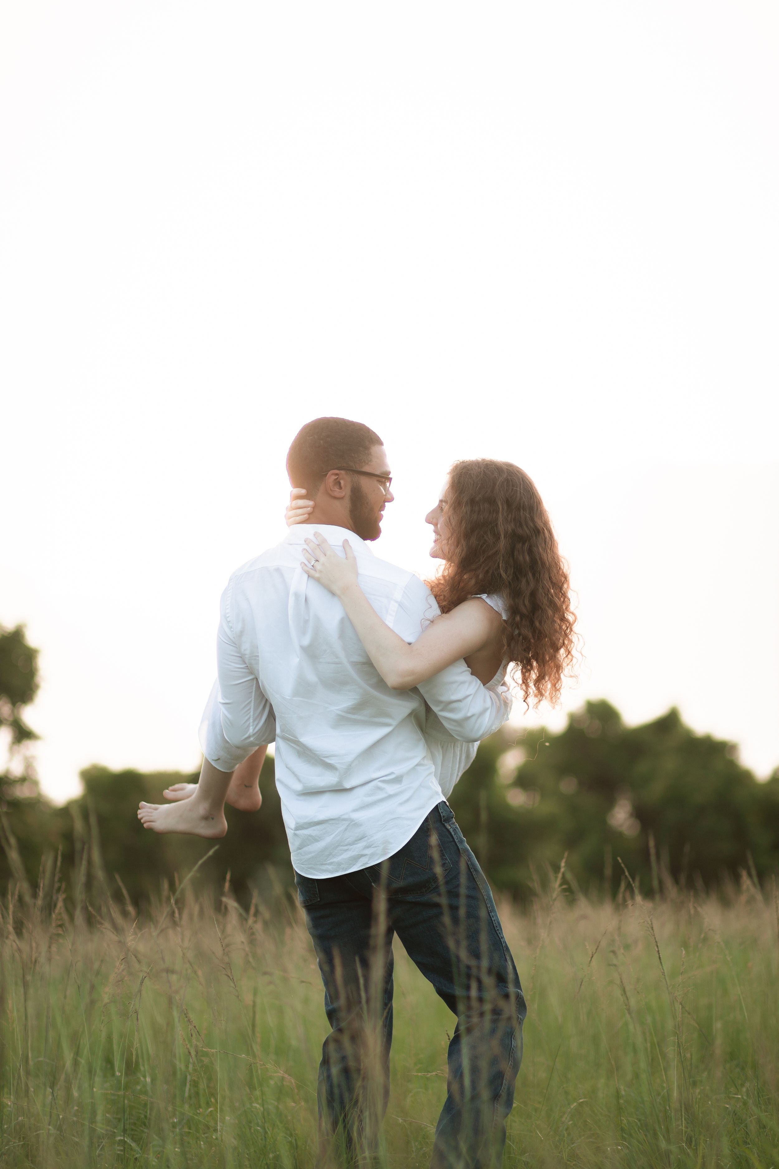 Cinematic Miami engagement portrait in open field, Instagram editorial style perfect for proposals and anniversaries by MannyPortraits.