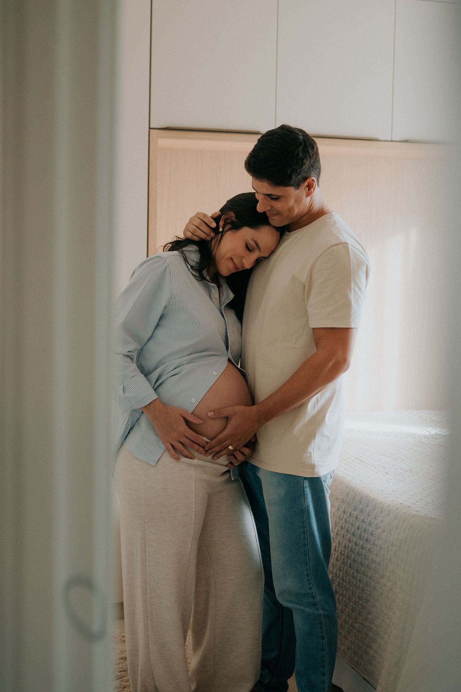 Intimate maternity session capturing tender moments between expectant parents.