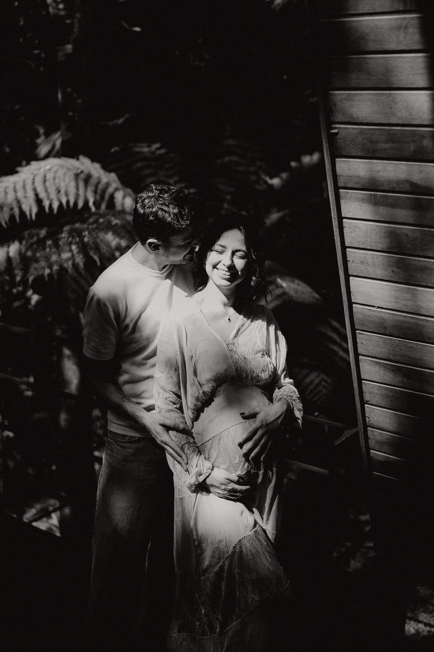 Black and white maternity photos capturing tender moments.